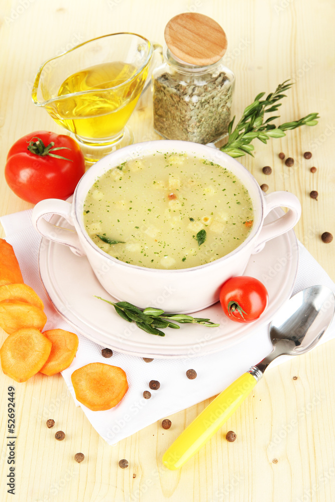 Nourishing soup in pink pan with ingredients Nourishing soup in pink pan with ingredients