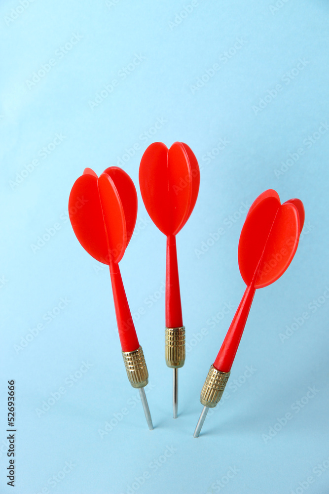 Darts on blue background Darts on blue background