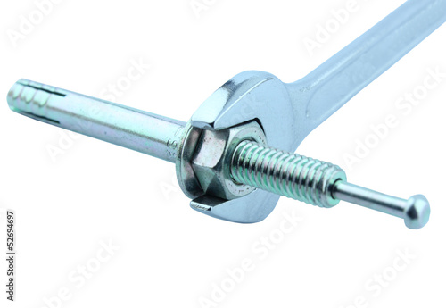 Detail of chrome wrench turning a nut on a bolt