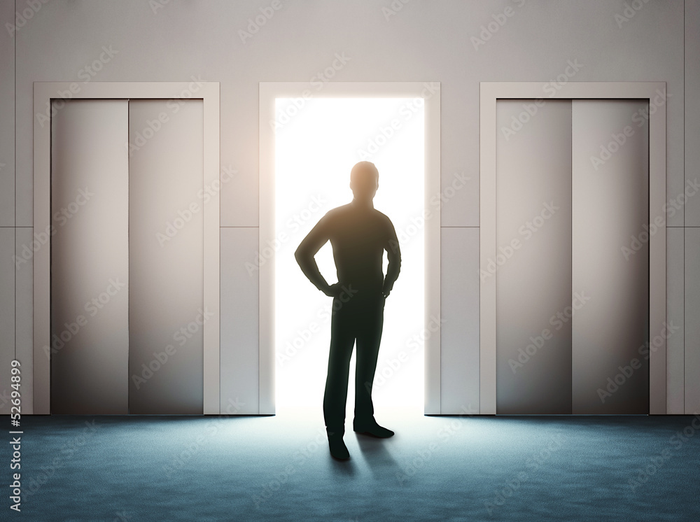 Fototapeta premium opened door with man silhouette