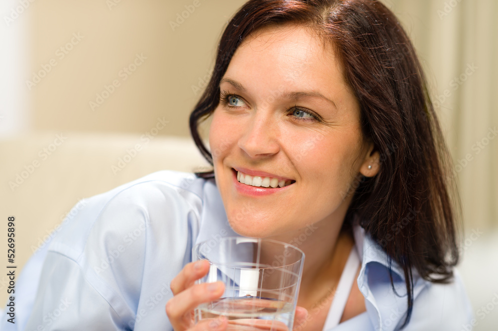 Smiling brunette woman with glass of water Smiling brunette woman with glass of water