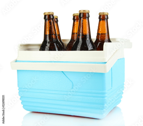 Traveling refrigerator with beer bottles isolated on white