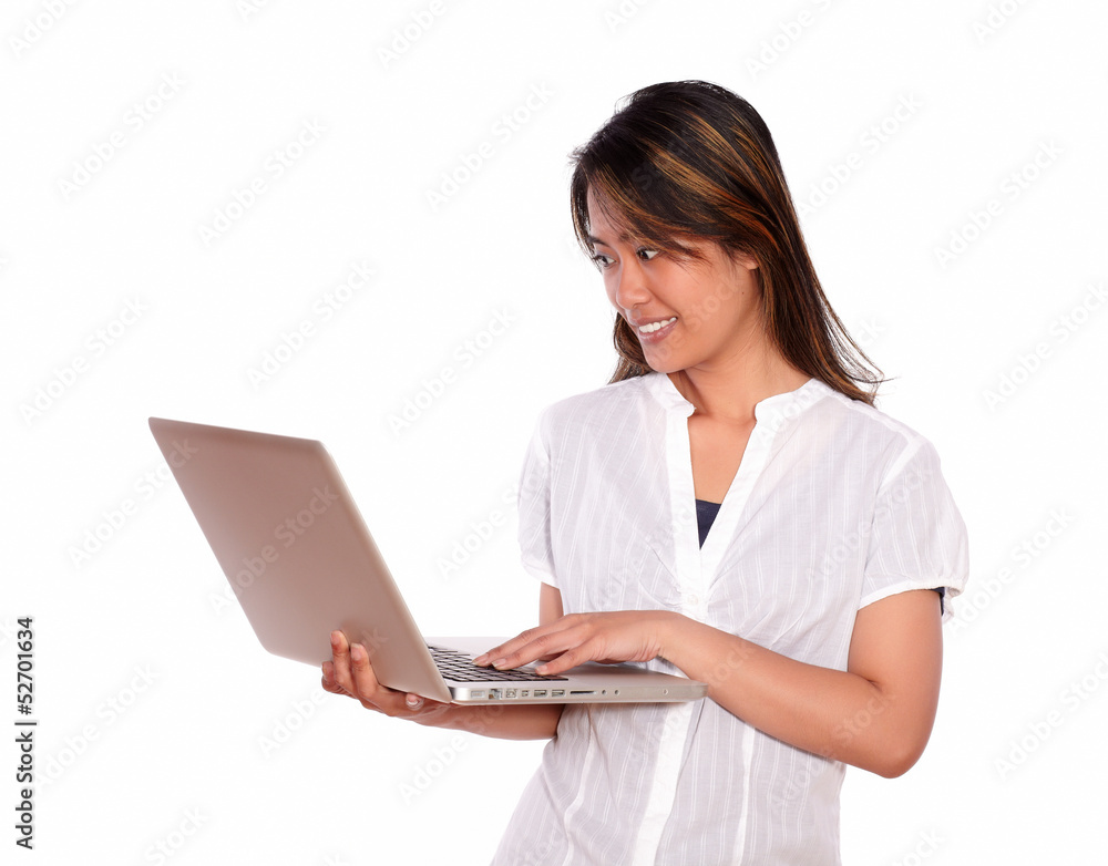 Smiling young woman reading on laptop screen Smiling young woman reading on laptop screen