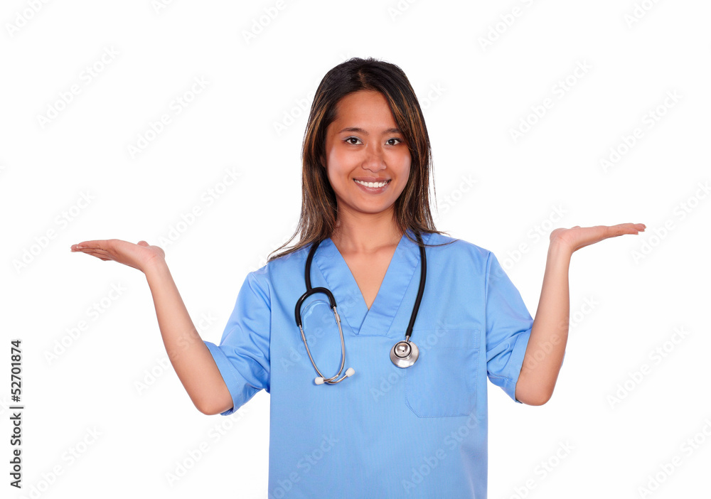 Smiling asiatic nurse woman holding out her palms Smiling asiatic nurse woman holding out her palms