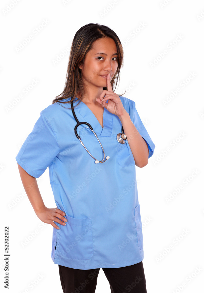 Charming asiatic nurse woman requesting silence Charming asiatic nurse woman requesting silence