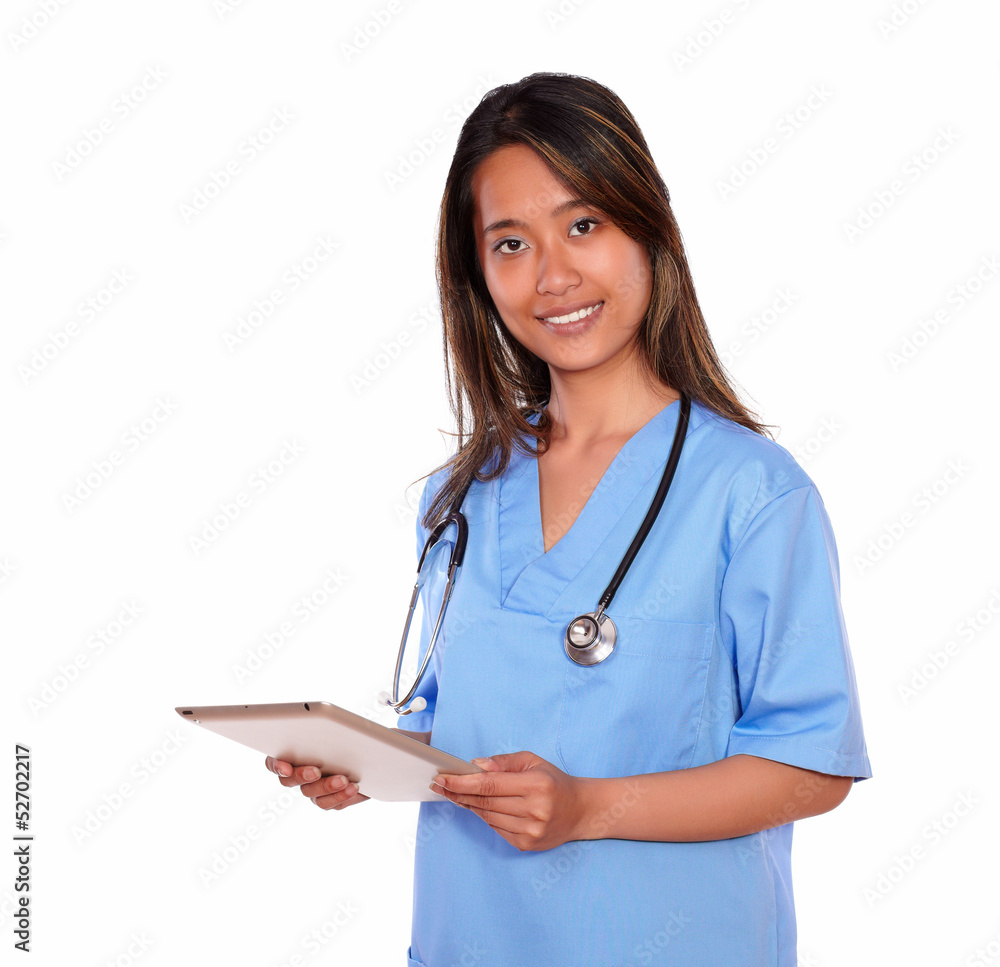 Charming asiatic nurse woman using her tablet pc Charming asiatic nurse woman using her tablet pc