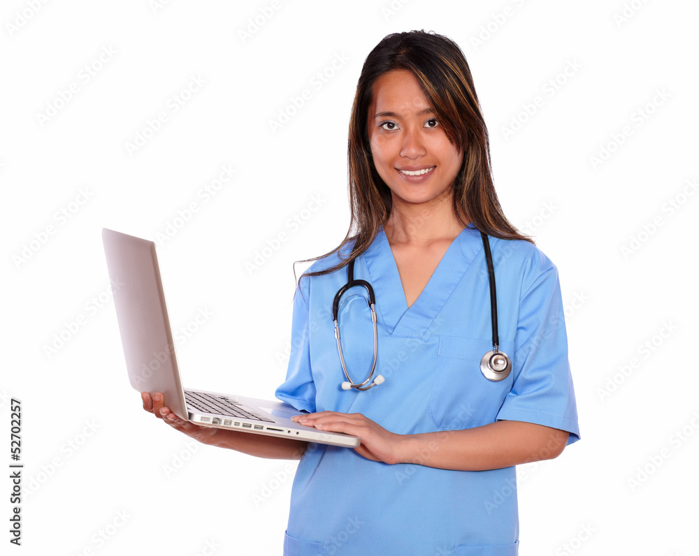 Charming asiatic nurse woman using her laptop Charming asiatic nurse woman using her laptop
