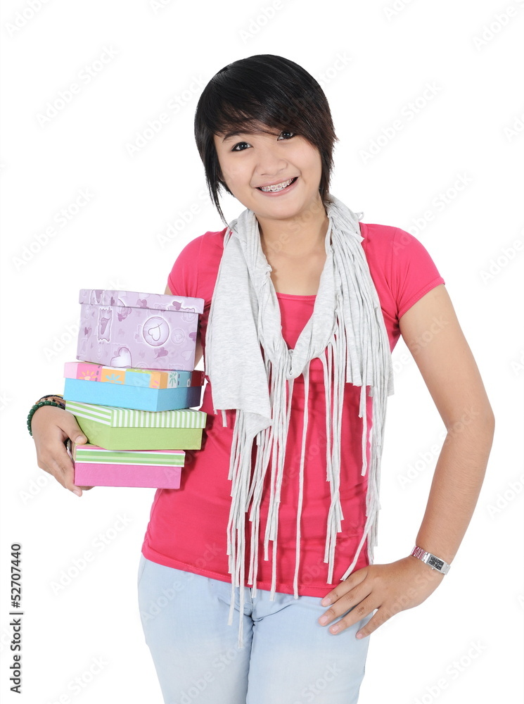 beautiful girl carrying stack of gifts with the right hand beautiful girl carrying stack of gifts with the right hand