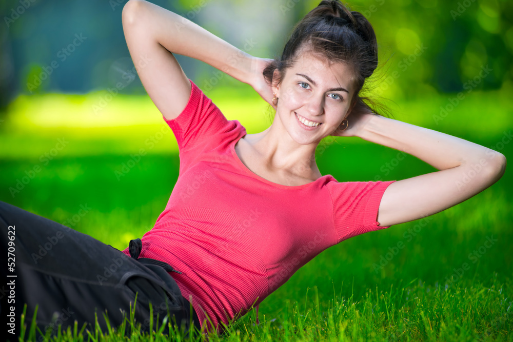 Woman doing exercises for abdominal muscles Woman doing exercises for abdominal muscles