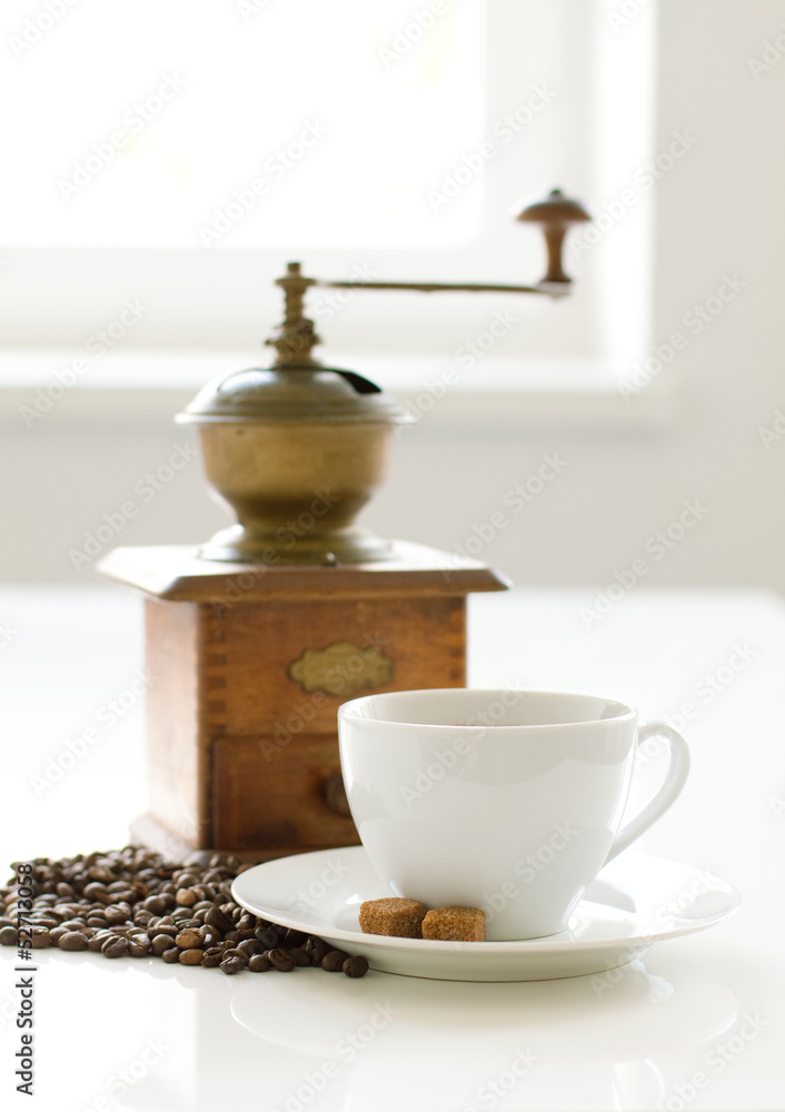 Cup of coffee with sugar and grinder Cup of coffee with sugar and grinder