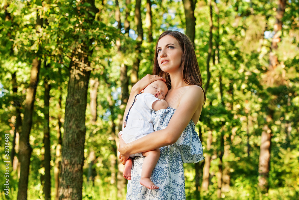 Mother with her child take rest in park Mother with her child take rest in park