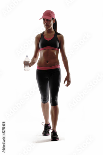 Mujer deportista sujetando una botella de agua. © Gustavo Andrade