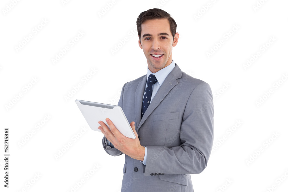 Happy businessman holding a tablet pc