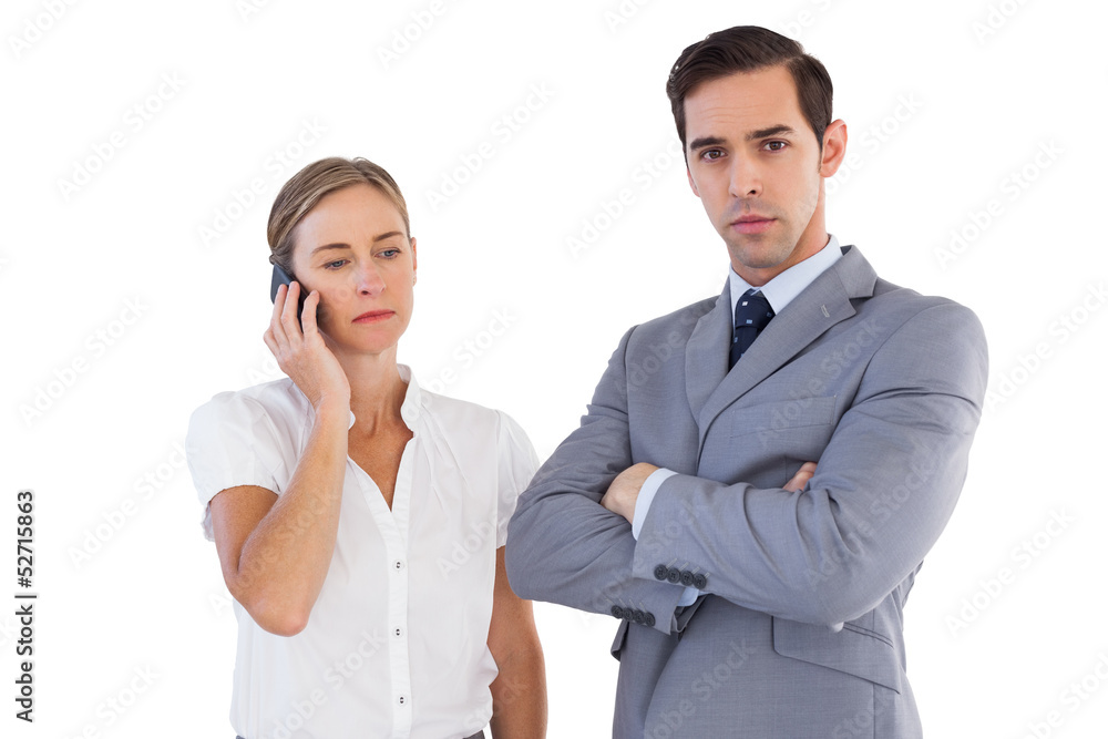 Businesswoman on the phone next to her colleague Businesswoman on the phone next to her colleague