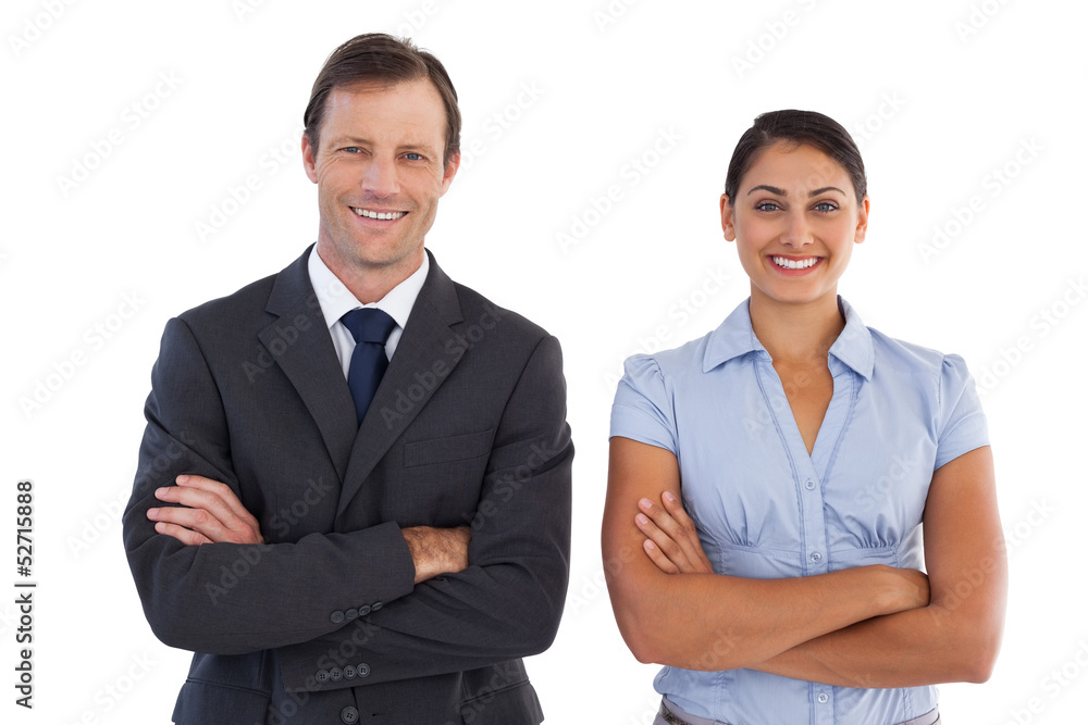 Smiling co workers standing next to each other Smiling co workers standing next to each other