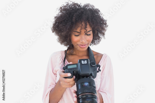 Happy woman looking at digital camera © WavebreakmediaMicro