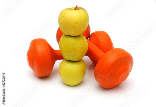 concept of healthy life with apples and weights