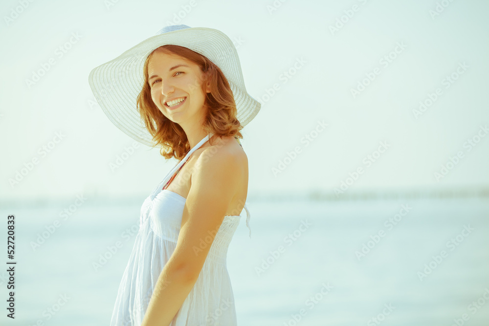 Caucasian woman rests at beautiful seashore Caucasian woman rests at beautiful seashore