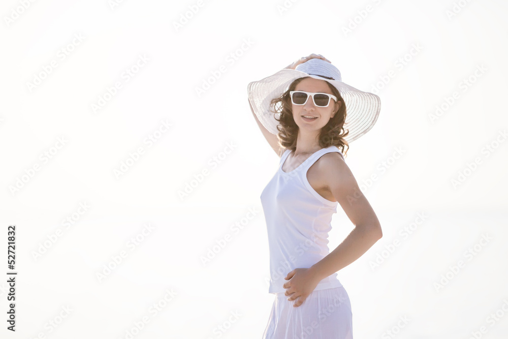 Caucasian woman rests at beautiful seashore Caucasian woman rests at beautiful seashore