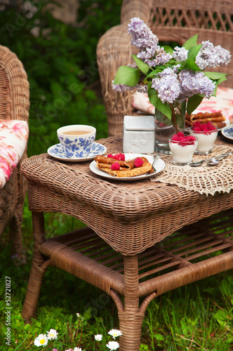 Breakfast at the garden with tea. Selective focus