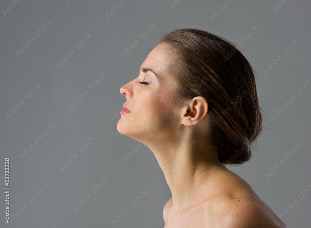 Beauty portrait of young woman isolated on gray background Beauty portrait of young woman isolated on gray background