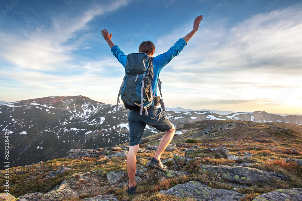 Backpacker on top of a mountaine Backpacker on top of a mountaine