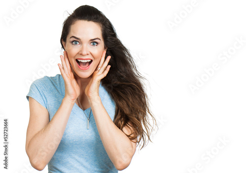 Surprised attractive woman looking at camera.