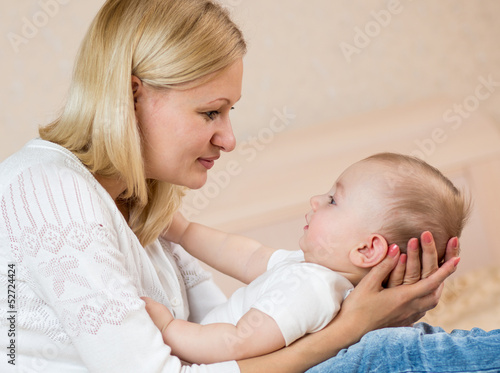 mother looking at baby boy ...