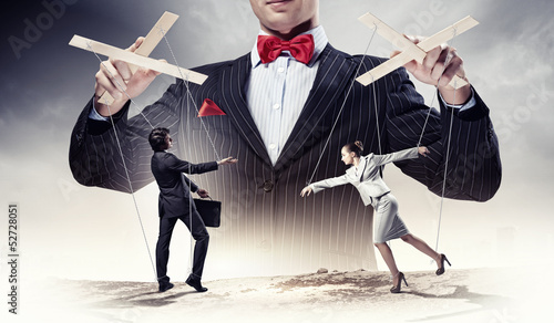 Foto Businessman puppeteer