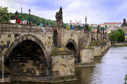 Fotografie Day shot of Charles Bridge in Prague, Czech Republic