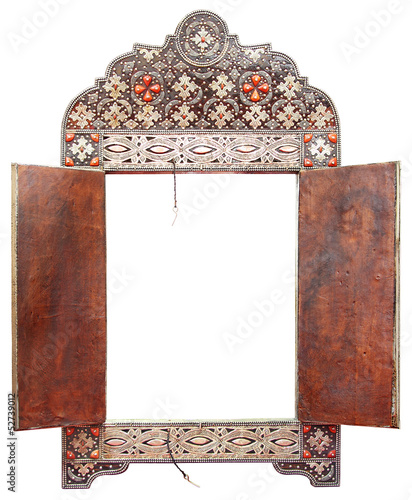 Antique Moroccan mirror frame made of silver and leather, isolated on white background  photo