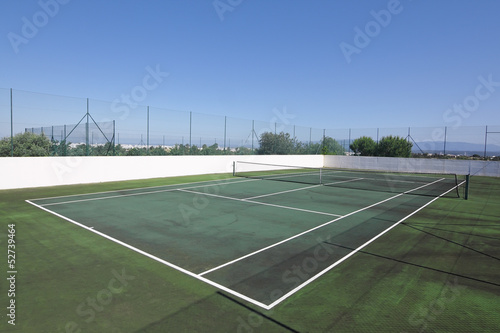 Tennis court without people in the summer for vacation.
