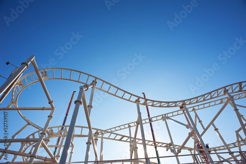 Roller-coaster with blue sky.
