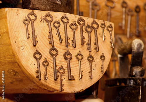 Old keys on wooden plank