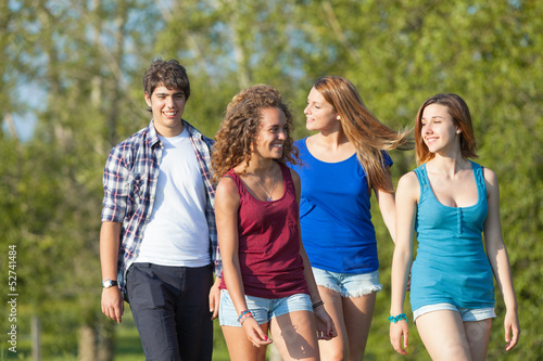 Group of Teenage Friends Walking at Park