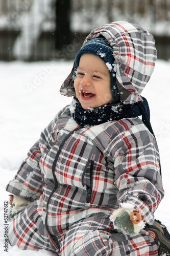 Boy playing in snow