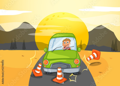A green car bumping the traffic cones