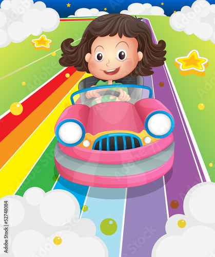 A girl driving her pink car