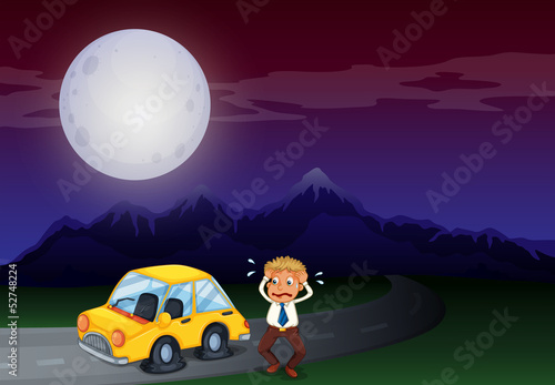 A boy with his car in flat tires