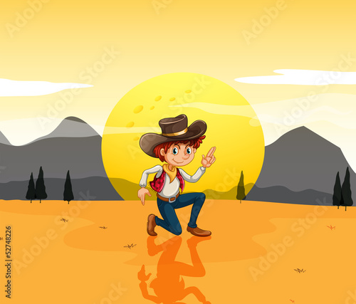 A boy with a hat at the desert