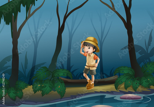 A girl in the middle of the forest near the river