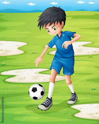 A boy sweating while playing football