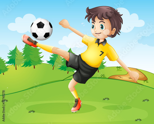 A female football player in her yellow uniform