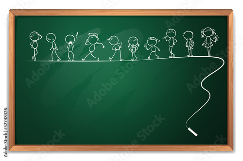 A blackboard with a drawing of kids dancing