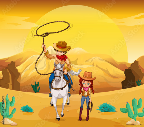 A cowboy and a cowgirl at the desert