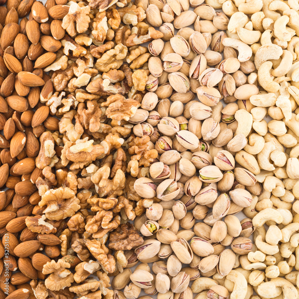Surface covered with different nuts Surface covered with different nuts