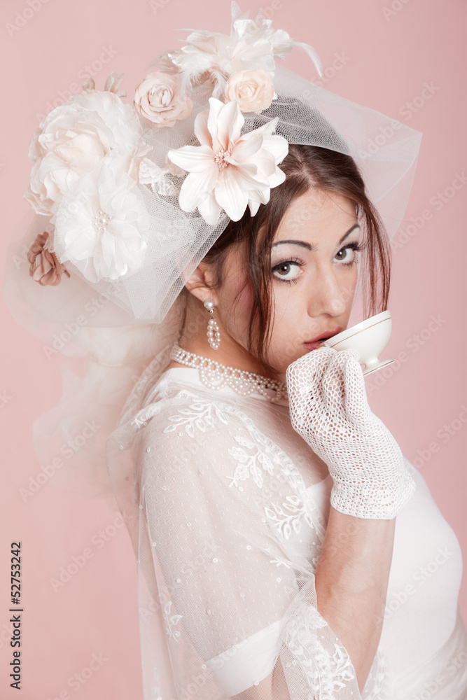 Retro romantic bride in white wedding dress drinking tea. Decora Retro romantic bride in white wedding dress drinking tea. Decora