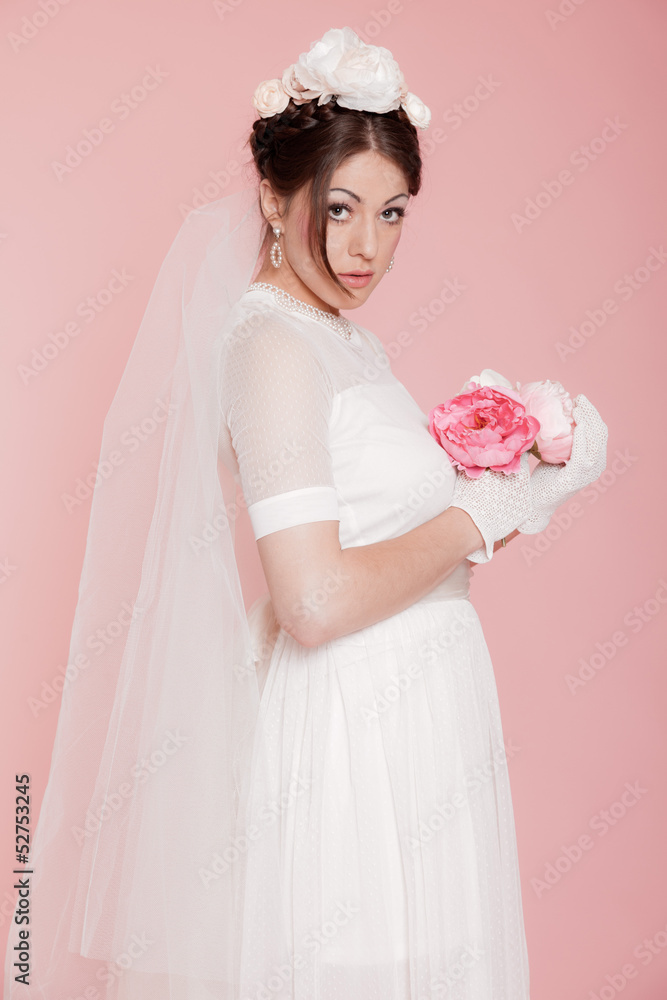 Retro romantic bride in white wedding dress. Decorated with flow Retro romantic bride in white wedding dress. Decorated with flow