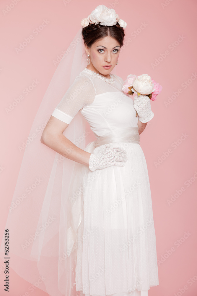 Retro romantic bride in white wedding dress. Decorated with flow Retro romantic bride in white wedding dress. Decorated with flow