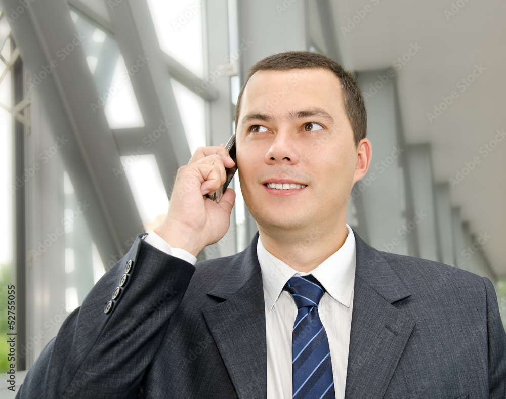 Portrait of young businessman calling by telephone Portrait of young businessman calling by telephone